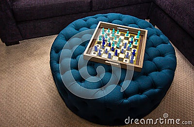 Wooden Tray Chess Board On Blue Ottoman Stock Photo