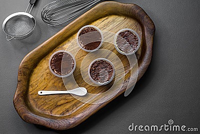 The wooden tray contains 4 cups Stock Photo