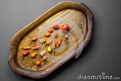 The wooden tray contains red chilies Stock Photo