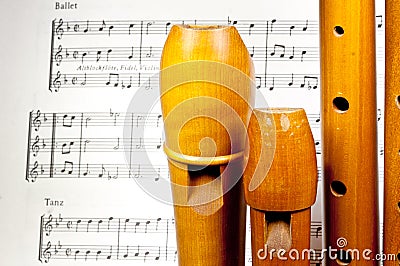 Wooden treble recorders with sheet music Stock Photo