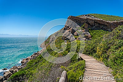 Wooden trek, path on a cliff with ocean on the background Stock Photo