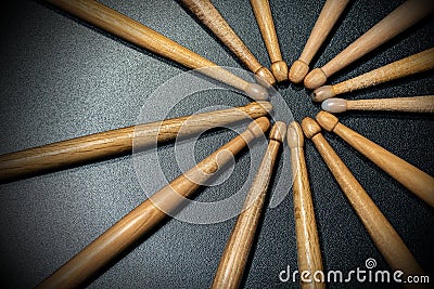 Wooden used drumsticks on a dark background - Percussion instrument 1 Stock Photo