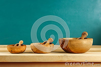 Wooden utensils. Wooden plates, cups, bowls. Dishes on shelf. Kitchenware Stock Photo
