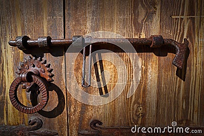 Wooden vintage door with latch rusty lock Stock Photo