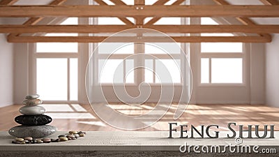Wooden vintage table shelf with pebble balance and 3d letters making the word feng shui over blurred empty room in eco house, wood Stock Photo