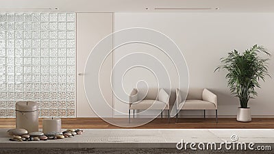 Wooden vintage table top or shelf with candles and pebbles, zen mood, over minimal waiting sitting room with parquet and glass Stock Photo