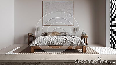 Wooden vintage table top or shelf closeup, zen mood, over minimal bedroom with double bed and decors, japandi architecture Stock Photo