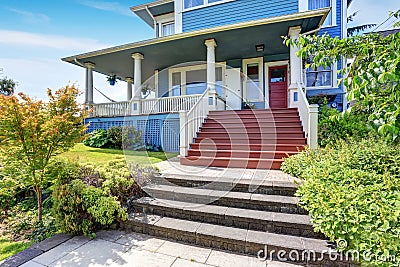 Wooden walkout porch of craftsman American house in blue tones Stock Photo