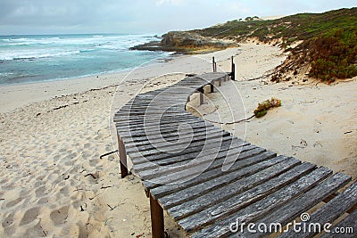 Wooden walkway onto beach Stock Photo