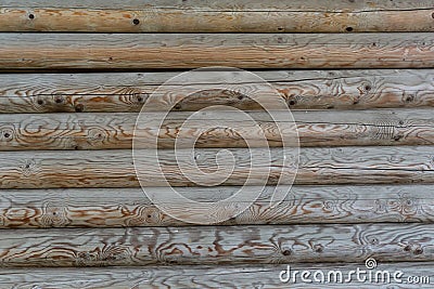 Wooden wall stacked of logs horizontally dark brown Stock Photo