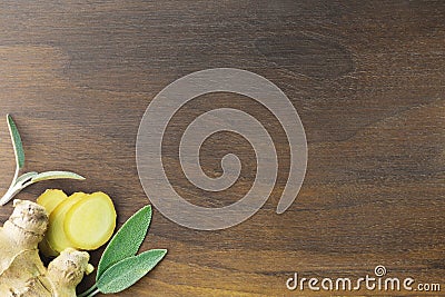 Wooden walnut cutting board with ginger and sage Stock Photo