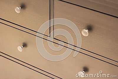 A wooden wardrobe drawer front, metal handle Stock Photo