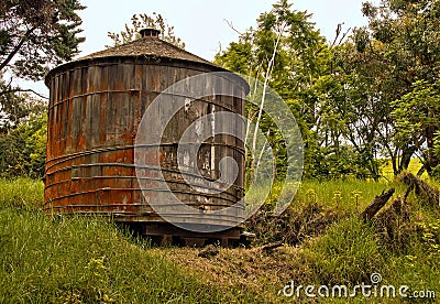 Wooden water tank in rural Hawaiian backcountry Stock Photo