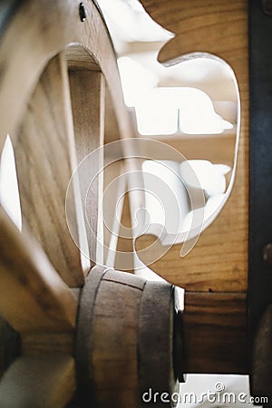 Wooden wheel of ancient peasant wagon close up view Stock Photo