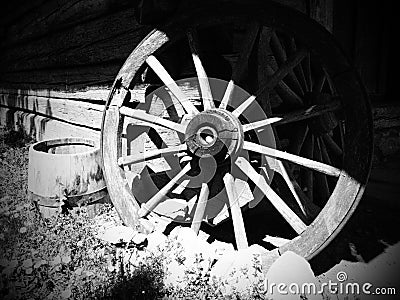 Wooden wheel from a cart. Decorative wheels for decorating lawns, exteriors and rustic interiors. Round homemade wheel Stock Photo