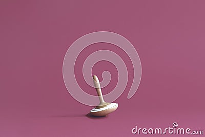 Wooden whirligig made of beech, with ceramic insert, on lilac background. Aroma diffusion device. Copy space. Stock Photo