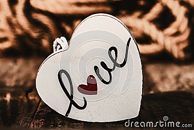 Wooden white decoration heart shaped with text love isolated. Romantic, love concept. Valentine`s day Stock Photo