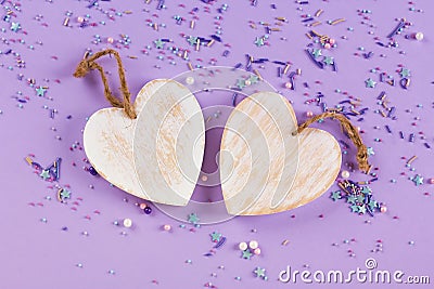 Wooden white hearts, rustic style, purple background, valentine`s day decor. Top view background. Stock Photo