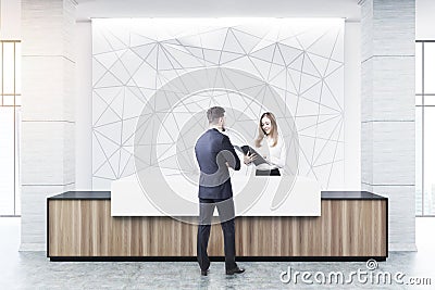 Wooden and white reception, geometric, people Stock Photo