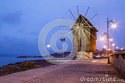 Wooden windmill in Nessebar at night Stock Photo