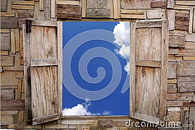 Wooden window opening over view of blue sky and cloud Stock Photo