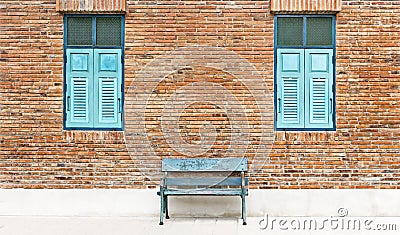 Wooden window shutter and chair iron color cyan with traditional Stock Photo