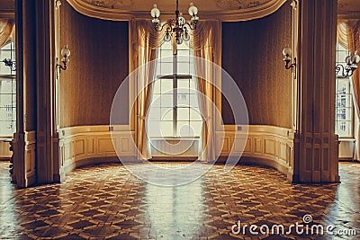 Wooden windows with vintage curtains and square moldings on a sunny day. beige satin curtains. interior of an empty room with Stock Photo