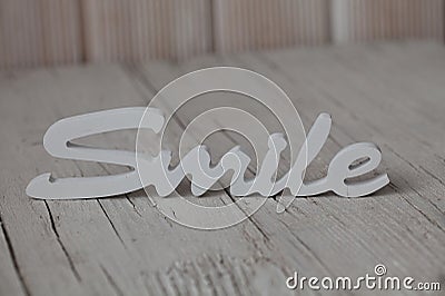 Wooden word smile Stock Photo