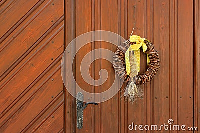 Wooden wreath with spirally woven corn dolly Stock Photo