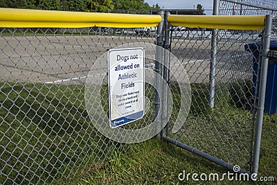 Woodinville, WA USA - circa May 2022: Close up view of a sign discouraging dogs on the athletic field at the Woodinville sports Editorial Stock Photo