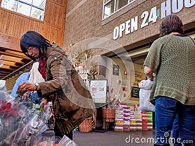 Customers shopping at the flower department in a Haggen Northwest Fresh grocery store Editorial Stock Photo