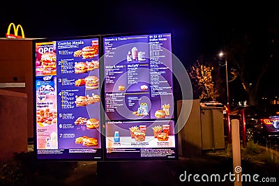 Woodland, CA, USA October 12th, 2022 Screen showing menu at the entrance of a local Mc Donalds restaurant Editorial Stock Photo
