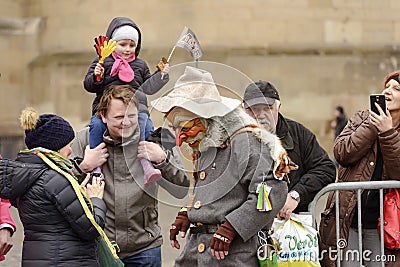 Woodland mask and bystanders at Carnival parade, Stuttgart Editorial Stock Photo