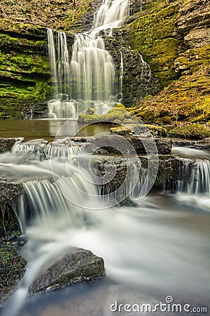 Woodland waterfall with small cascades. Stock Photo