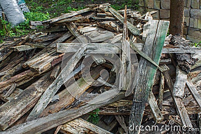 Woodpile of wooden planks. Pile of aged wood bark Stock Photo