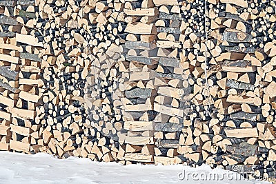 Woodshed with pieces of wood cut for the stove Stock Photo