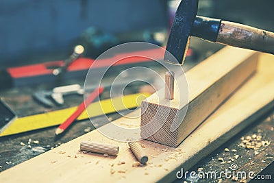Woodworking - making wooden dowel joint Stock Photo