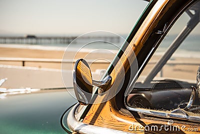 Woody surf car in california at the beach with pier Stock Photo