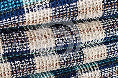Wool fabric for a plaid with a pattern consisting of colored cells Stock Photo