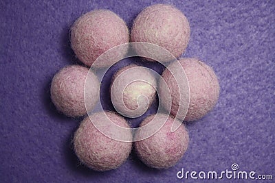 Woolen beads on a violet background Stock Photo