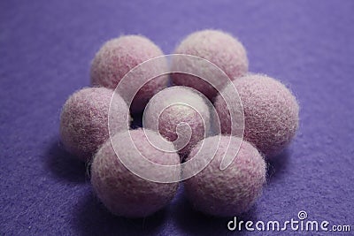 Woolen beads on a violet background Stock Photo