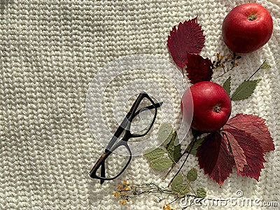 Woolen white background. Red apples on a wooden background Stock Photo