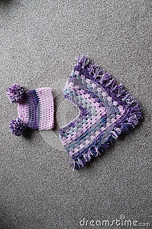 Baby crochet poncho and hat Stock Photo