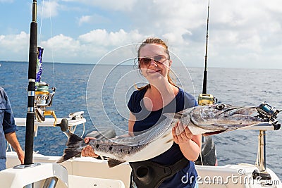 Wooman at deep sea fishing Stock Photo