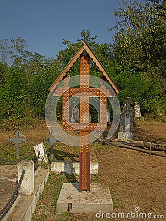 Wooden cross on a cemetery in the Romanian countryside Editorial Stock Photo