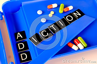 Word addiction on a pharmaceutical tablet counter Stock Photo