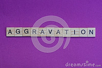 Word aggravation from small gray wooden letters Stock Photo