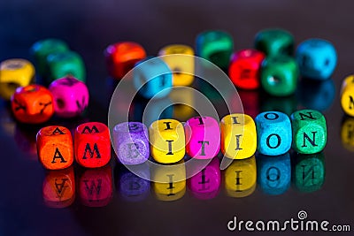 Word `ambitions` of the colored wooden cubes Stock Photo