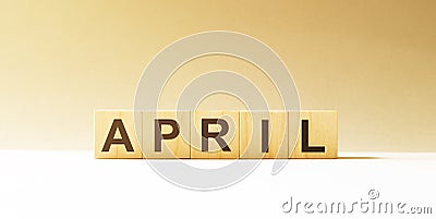 Word April made with wood building blocks Stock Photo