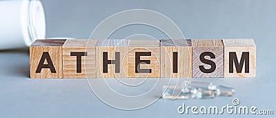 The word of ATHEISM on building blocks, medicine concept Stock Photo